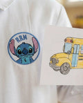 Grembiule asilo bambina bianco con bottoni ricamo Disney Stitch